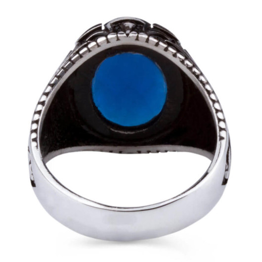 خاتم فضة للرجال عيار 925 مزخرف الجوانب ومرصع بحجر الزركون الأزرق