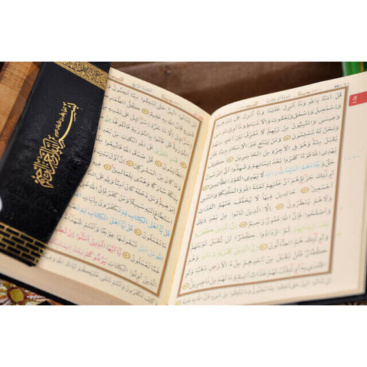 A Hajj And Umrah Gift Set Comprising A Quran, Prayer Rug, Rosary