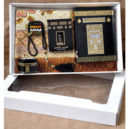 A Hajj And Umrah Gift Set Comprising A Quran, Prayer Rug, Rosary