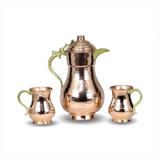 A Set Of Brass Cups With A Handmade Pitcher