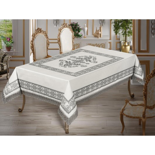 A Rectangular Tablecloth Printed In Different Colors Surrounded By Lace On 4 Sides