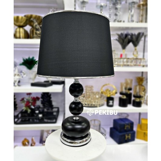 A Table Lamp, A Modern Model, With A Distinctive Holder, In A Black And Silver Ball Pattern