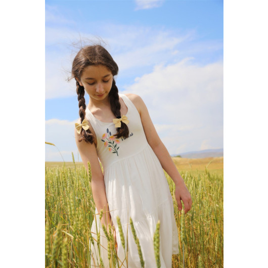 فستان بناتي بحمالات بلون أبيض مزين بزهور لعمر بين 08 - 14 سنة