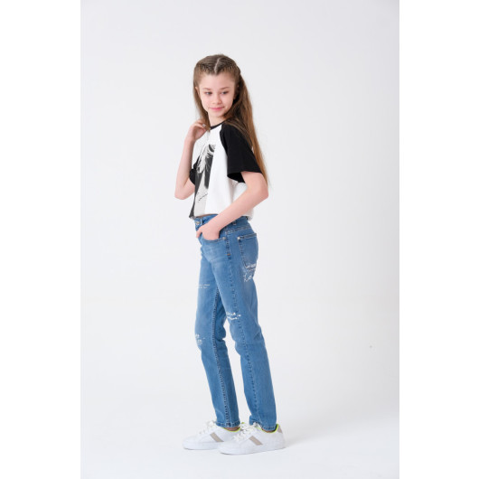 بنطال جينز بناتي لون ازرق بطبعات من 9 إلى 13 عامًا