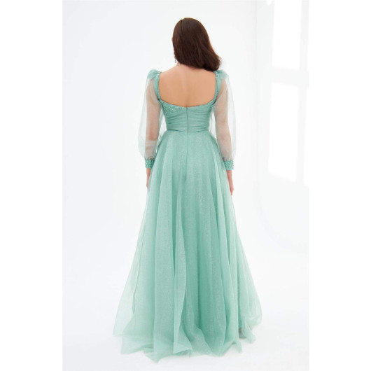 فستان خطوبة طويل مزين بالتول لامع اخضر