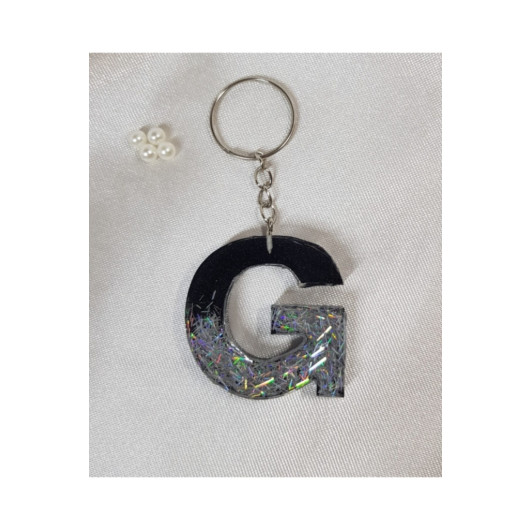 علاقة مفاتيح من الايبوكسي شفاف برسمة حرف G