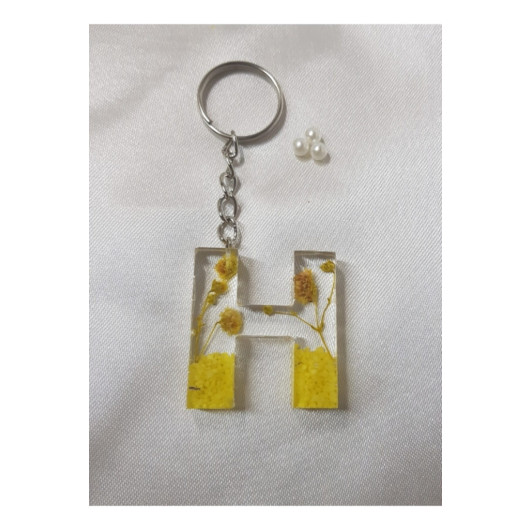 ميدالية مفاتيح من الايبوكسي برسمة حرف H شفاف