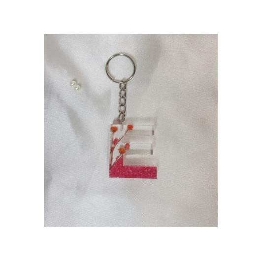ميدالية مفاتيح ايبوكسي برسمة حرف E شفافة