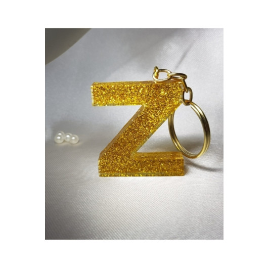 ميدالية مفاتيح ذهبية من الايبوكسي برسمة حرف Z