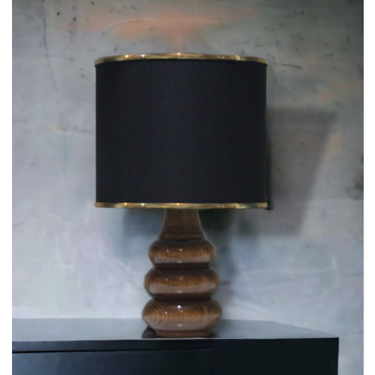 Small Black And Gold Lamp With A Wooden Base