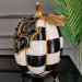 A Decorative Piece In The Shape Of A Carved Pumpkin For Kitchen Decor