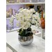 A Vase With A Japanese Design And An Orchid With 6 Branches Arranged In Silver Color