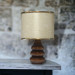Small Light Pink And Gold Lamp With A Wooden Base