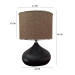 Black Desk Lamp With A Beige Head And A Silver Ribbon