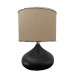 Black Desk Lamp With A Light Pink Head And A Silver Ribbon